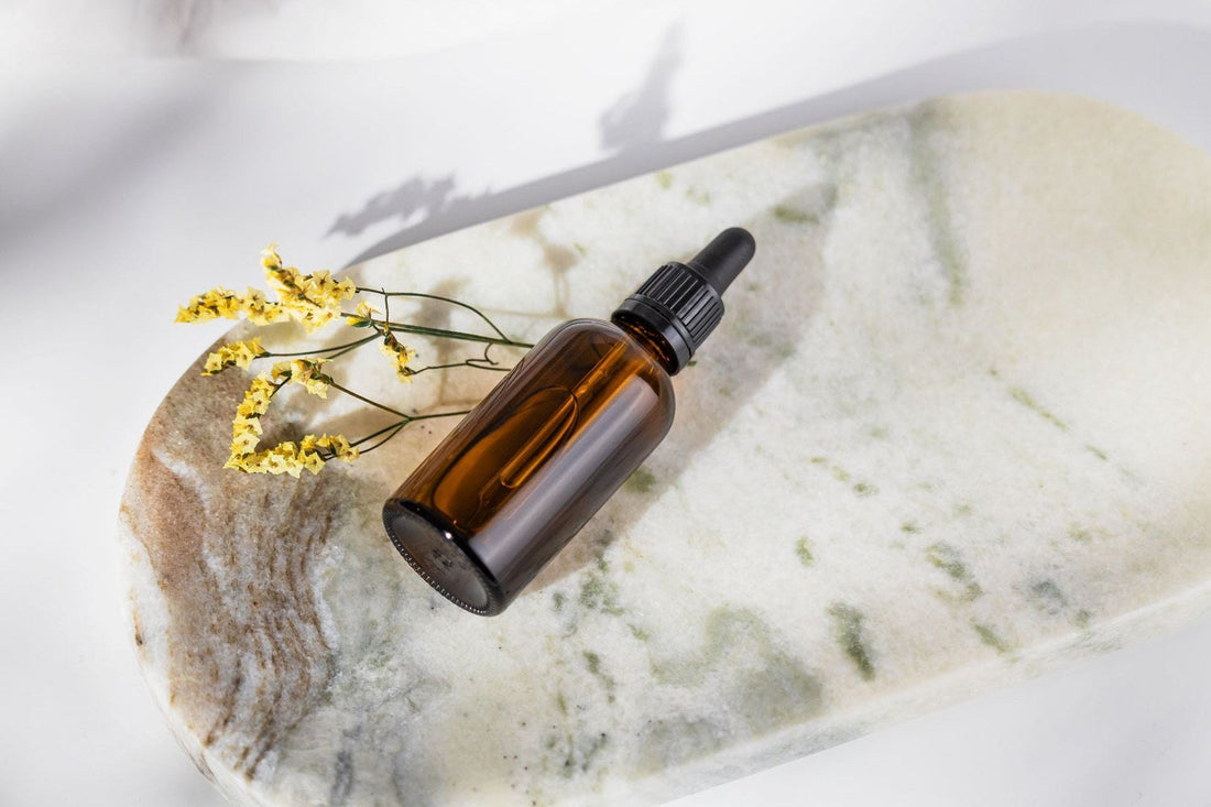 Applying cold-pressed carrier oil to skin